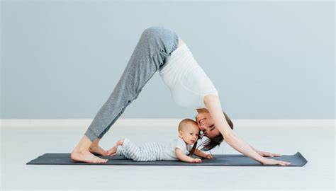 Lady and baby on exercise mat representing post natal exercise